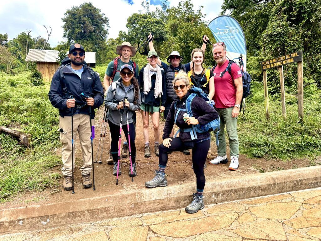 A group of people are posing for a picture while hiking.