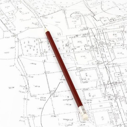 a red pencil is laying on top of a map