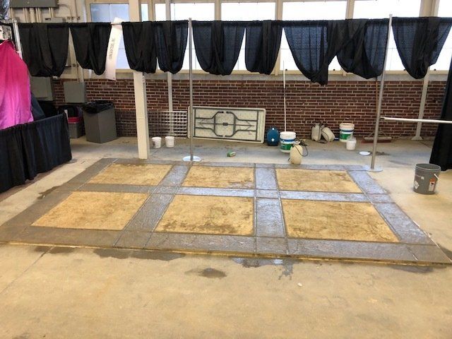 Dried Concrete Floor with Curtains on Back — Noblesville, IN — Concrafters Inc.