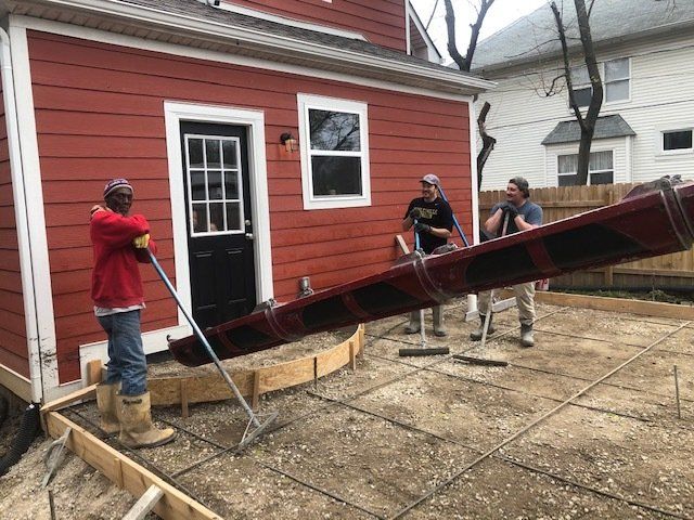 Workers Working on Residential Driveway — Noblesville, IN — Concrafters Inc.