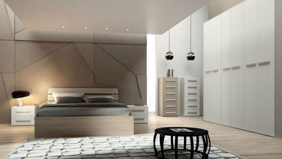 camera da letto con parete color tortora e faretti sul soffitto