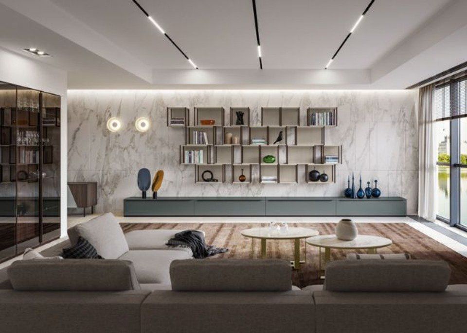 salotto con arredi moderni e parete effetto marmo