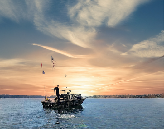 Boat on calm water at sunset; person on deck, orange and blue sky.