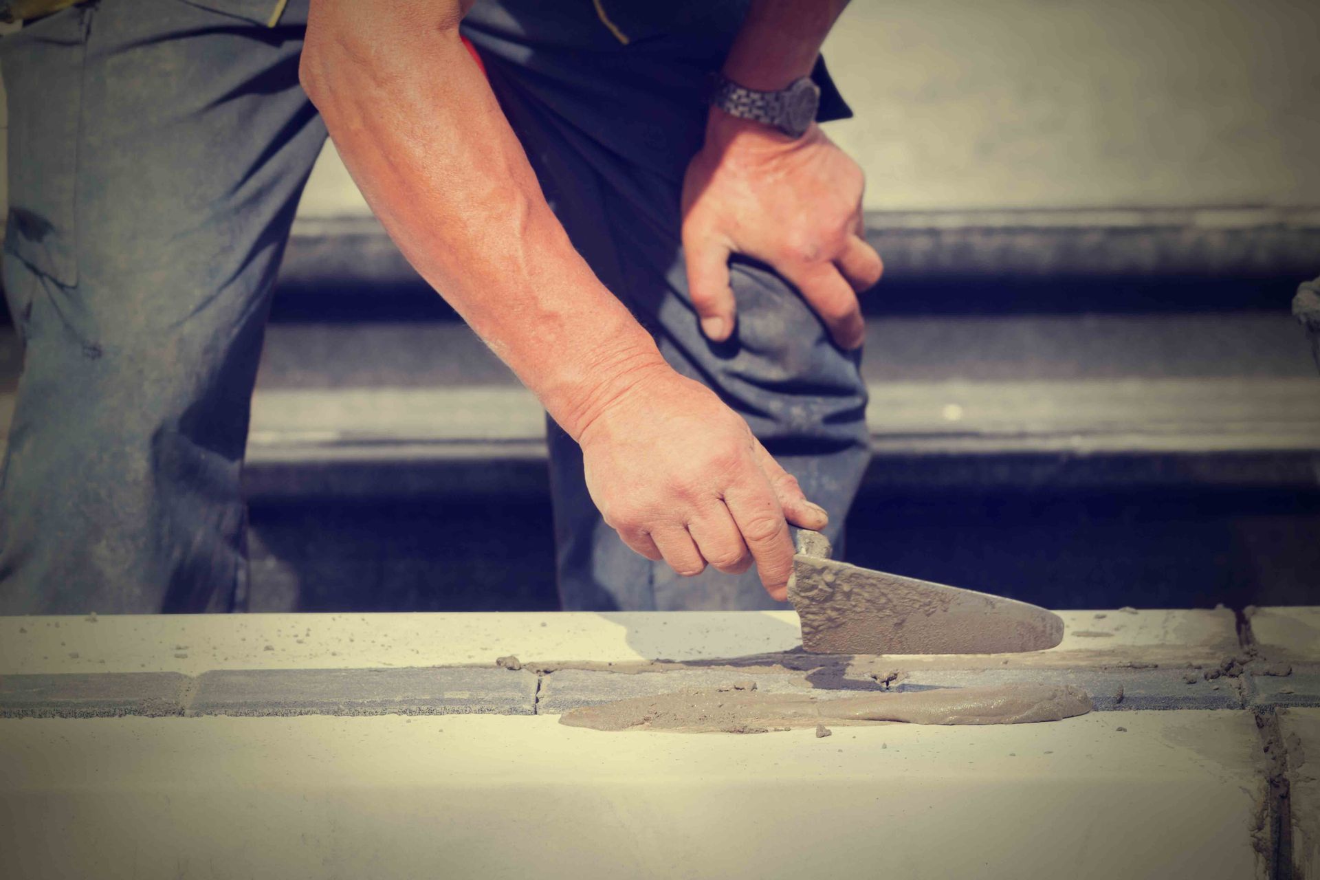 A person working on a concrete surface | Residential Concrete Contactor in Lincoln NE