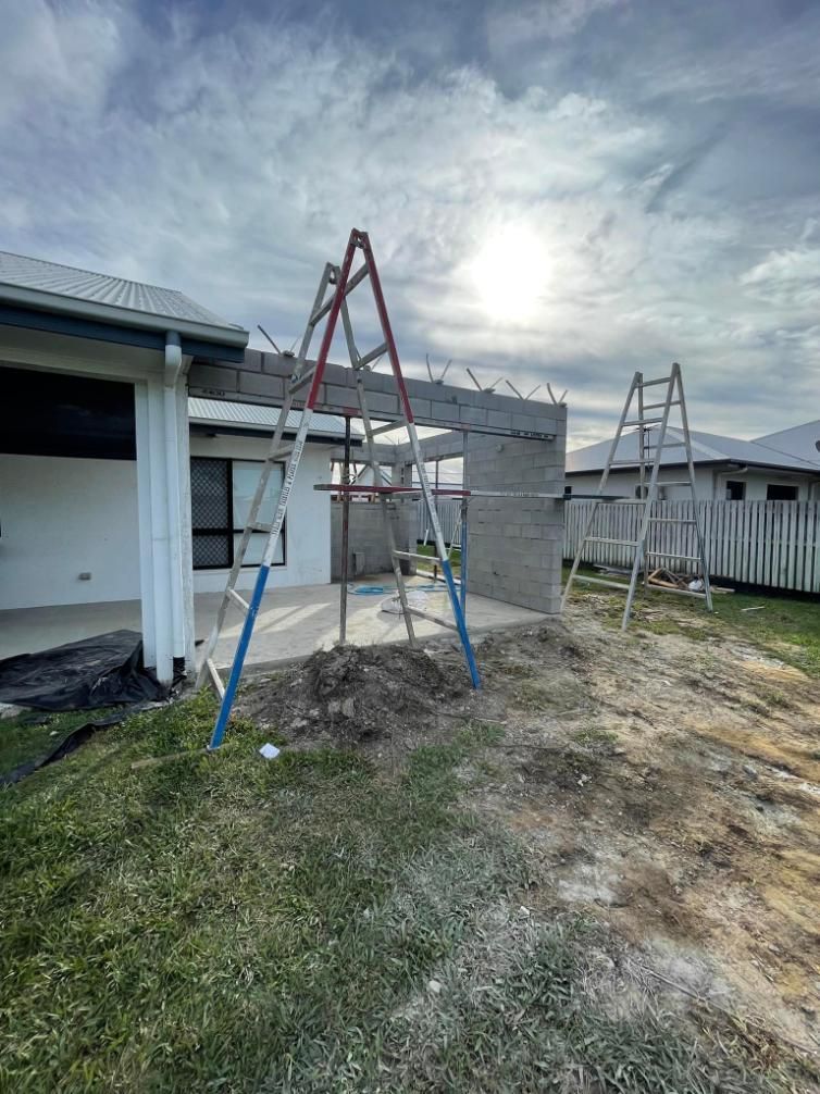 A Ladder is Sitting in Front of a House Under Construction — Wilkinson Homes in Annandale, QLD