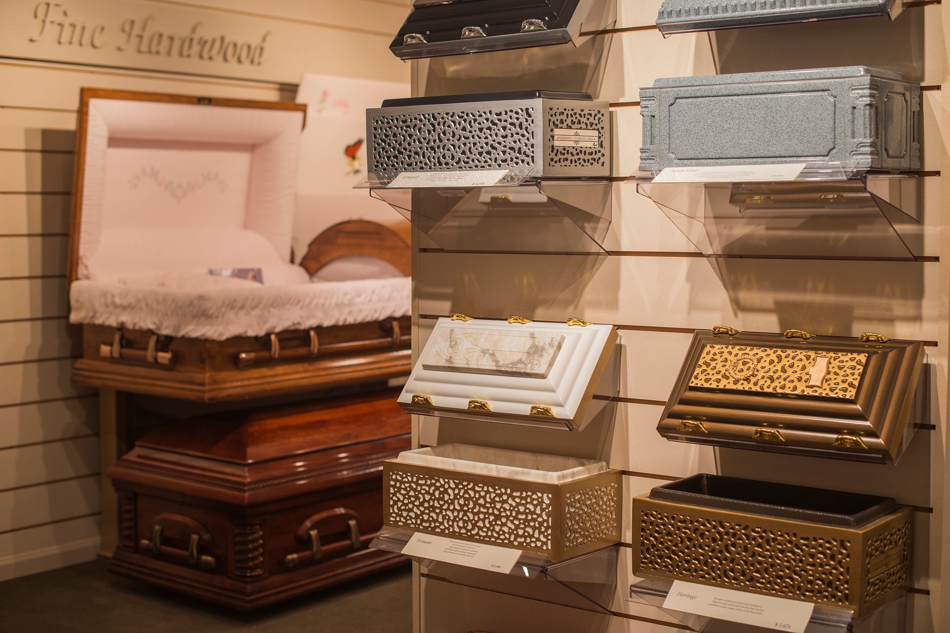 There are many different types of coffins on display in this room.