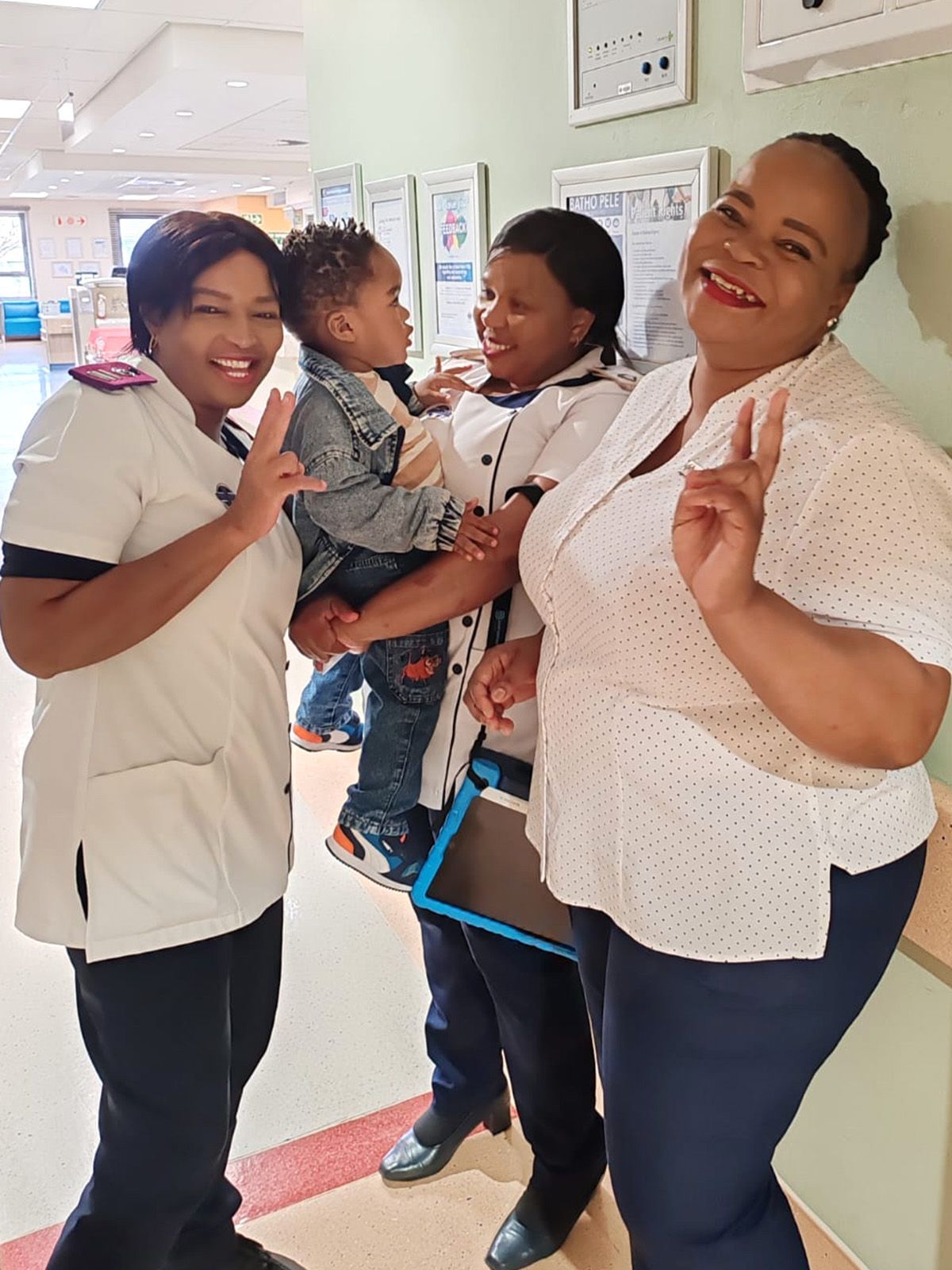 Registered nurse Dikeledi Ramatlo, Enrolled Nurse Tholakele Dhladhla and unit manager of the paediatric ICU at Netcare Waterfall City Hospital Sr Jabulile Nxumalo are pictured with drowning survivor Sekani Nzima during a recent check up.