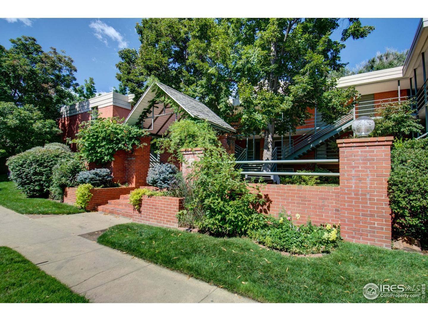 short term rental property management company photo of boulder two story green home with spacious yard available for rent at Sundance Film Festival