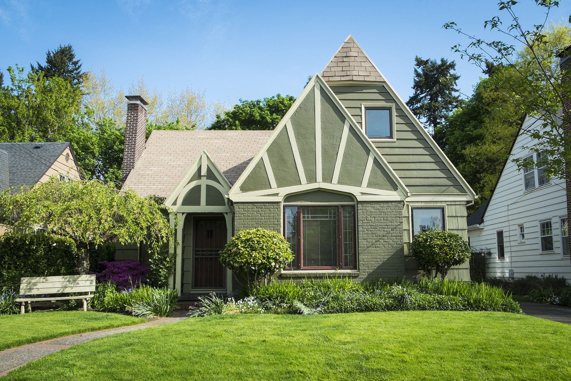 Small green bungalow single family home