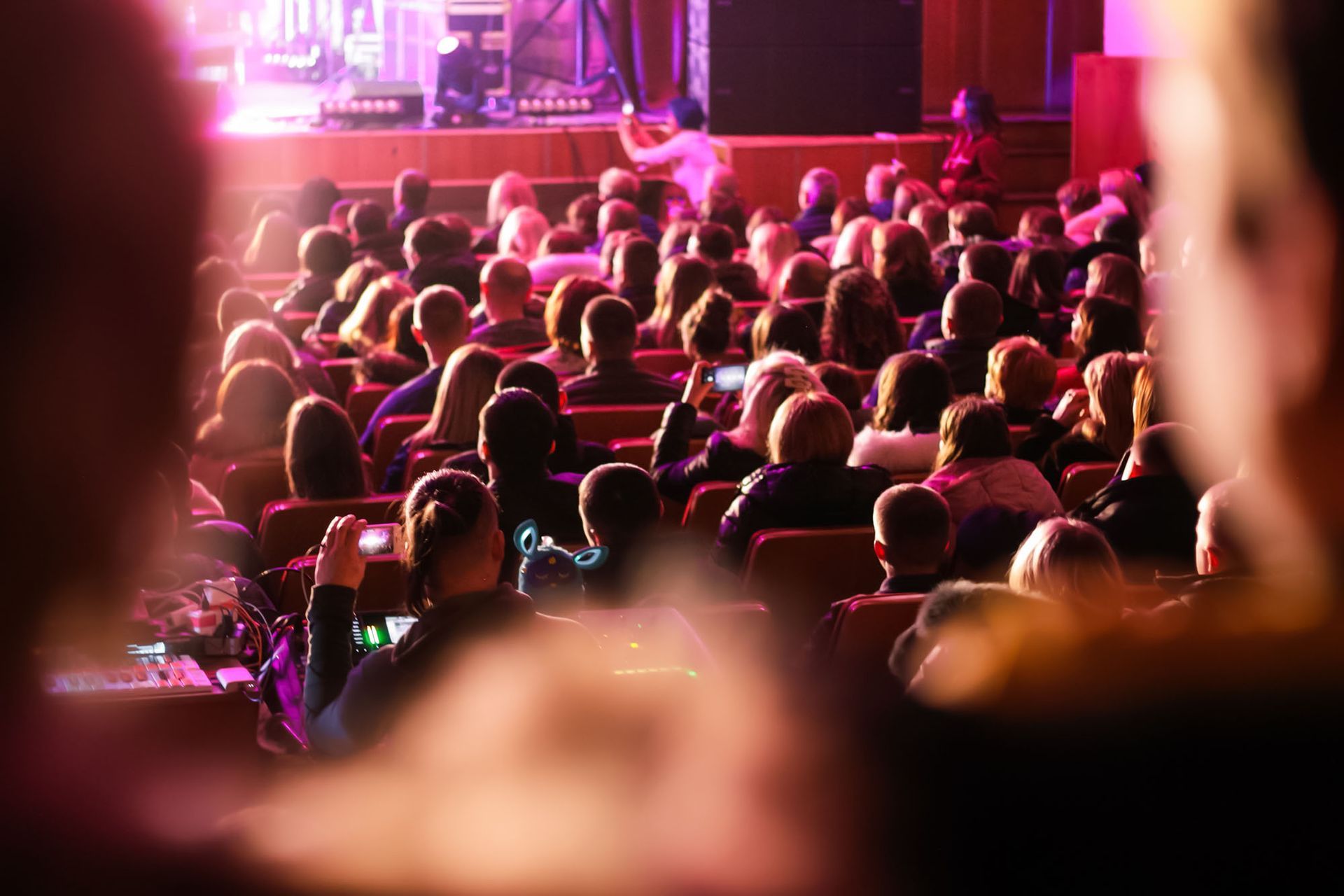 theater with a large crowd watching film festival