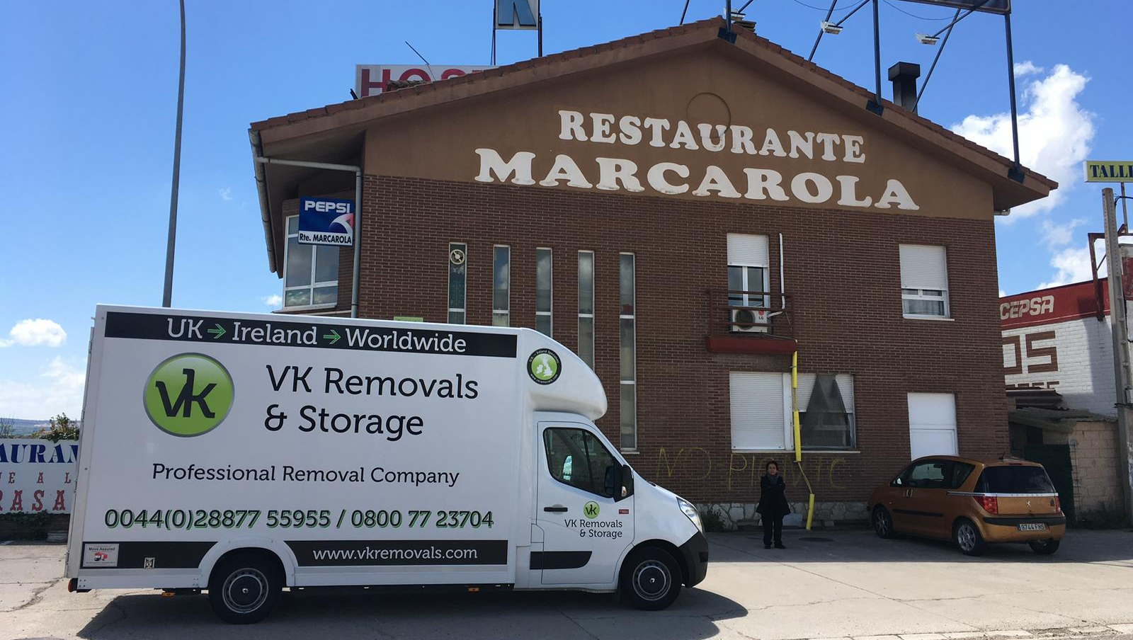White moving van in front of a