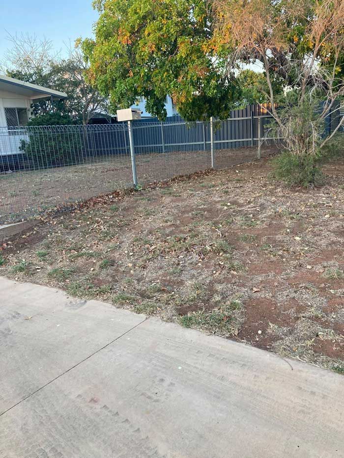 Yard With A Fence And A House In The Background After — NQES Industries in Burketown, QLD