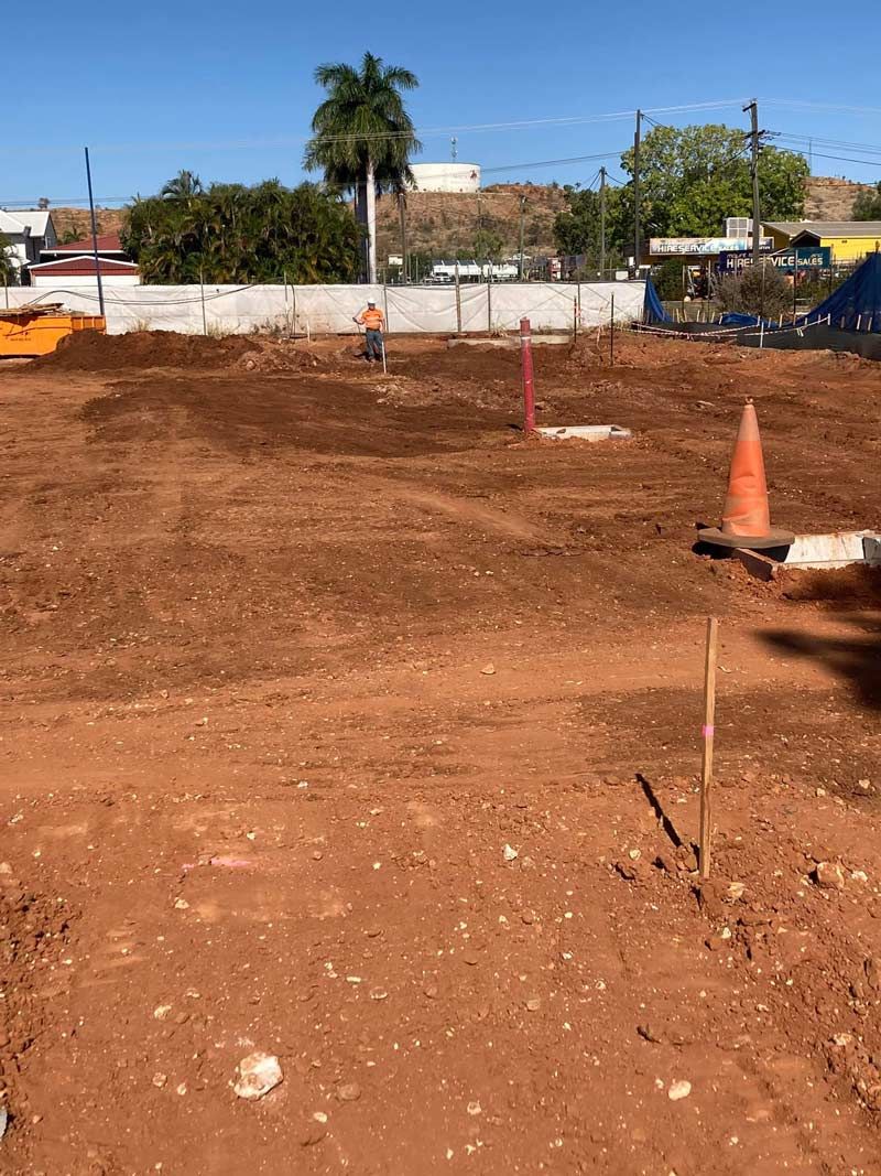 A Worksite With A Safety Cone And A Shovel — NQES Industries in  Mount Isa, QLD