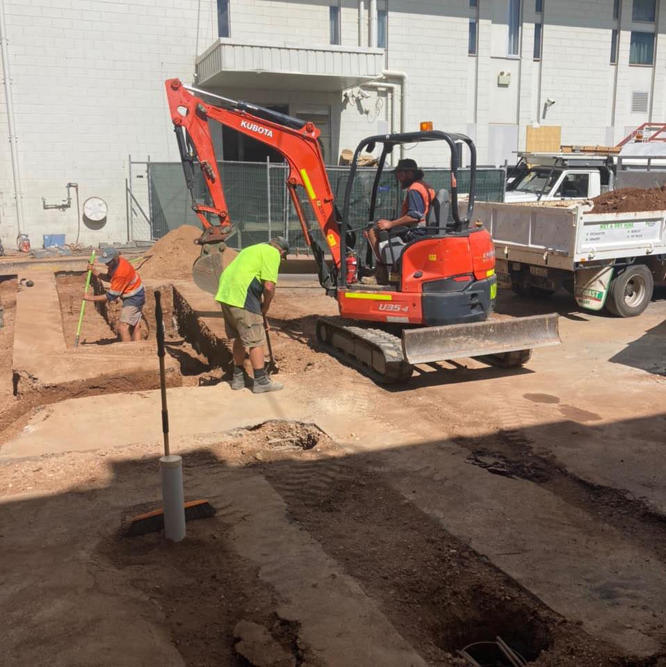 Construction Worker Digging The With The Excavator In The Construction Site — NQES Industries in Cloncurry, QLD