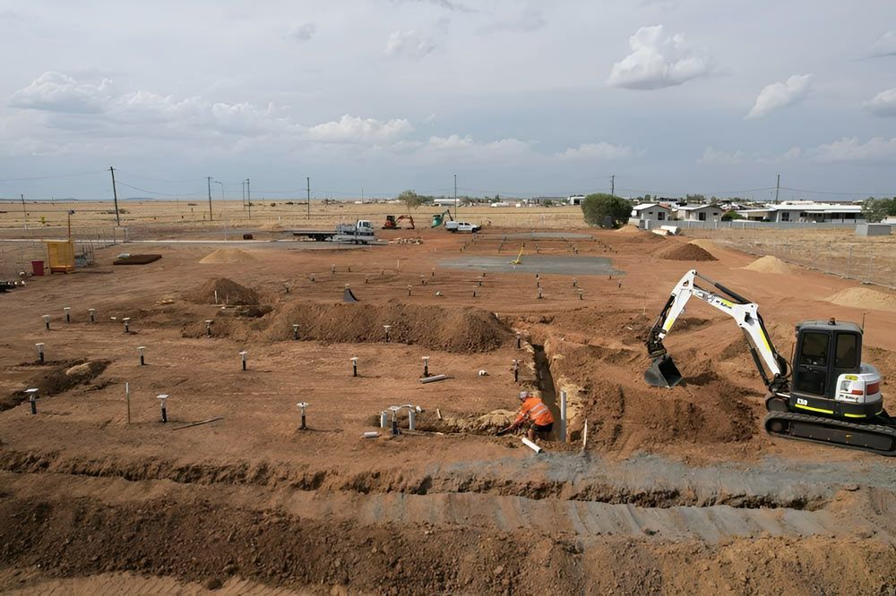 Aerial View Of Digging And Building A New Subdivision — NQES Industries in Ryan, QLD