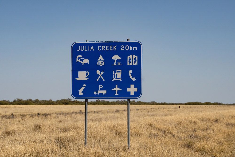 Blue And White Sign Julia Creek — NQES Industries in Julia Creek, QLD