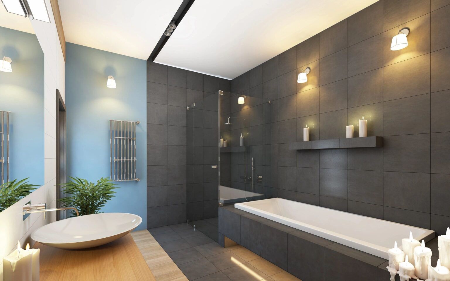 Modern bathroom with gray tiled walls, a soaking tub, and a glass shower.