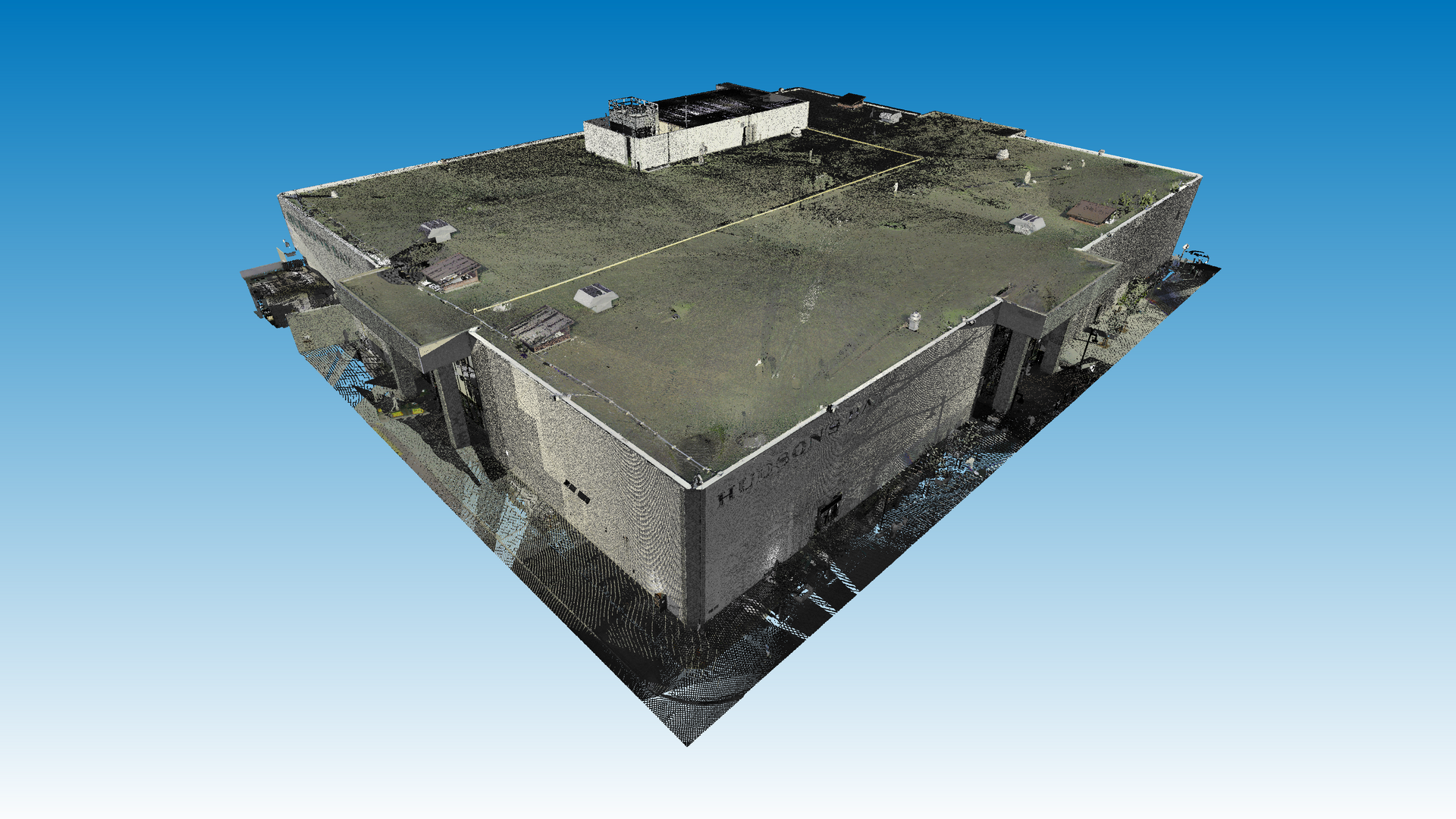 Tripod-mounted device in empty warehouse with high ceiling, gray floor, yellow support poles.