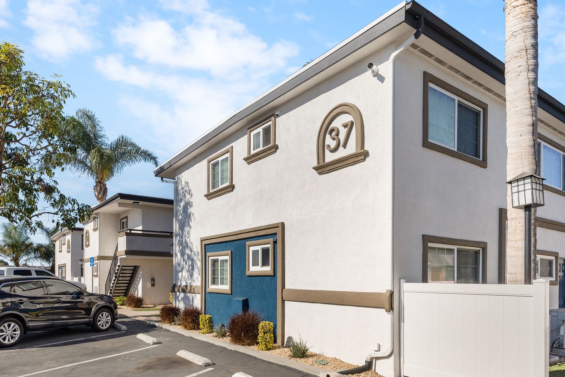 Apartment exterior and open parking spaces