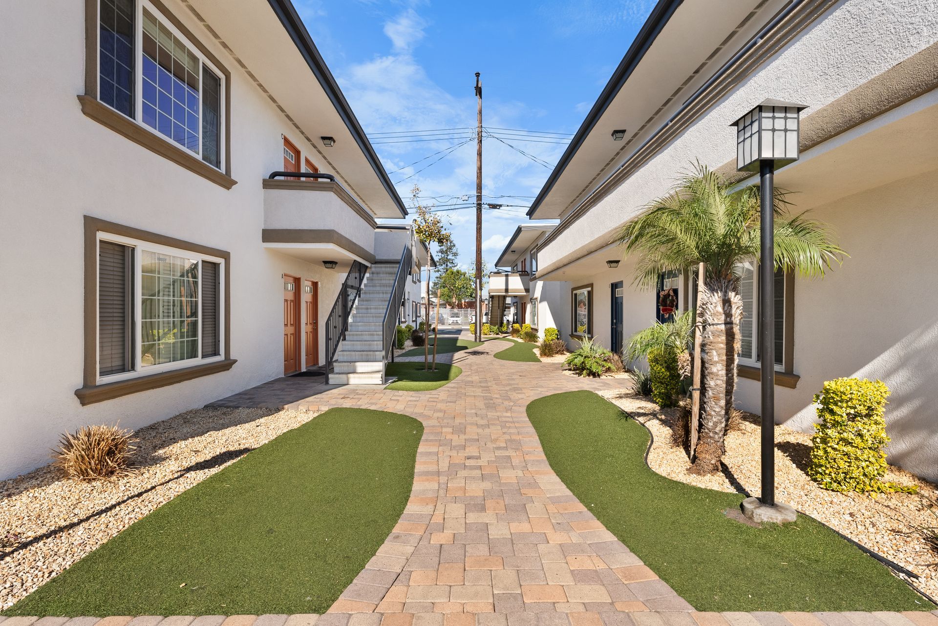 Walkway between apartment buildings and turf