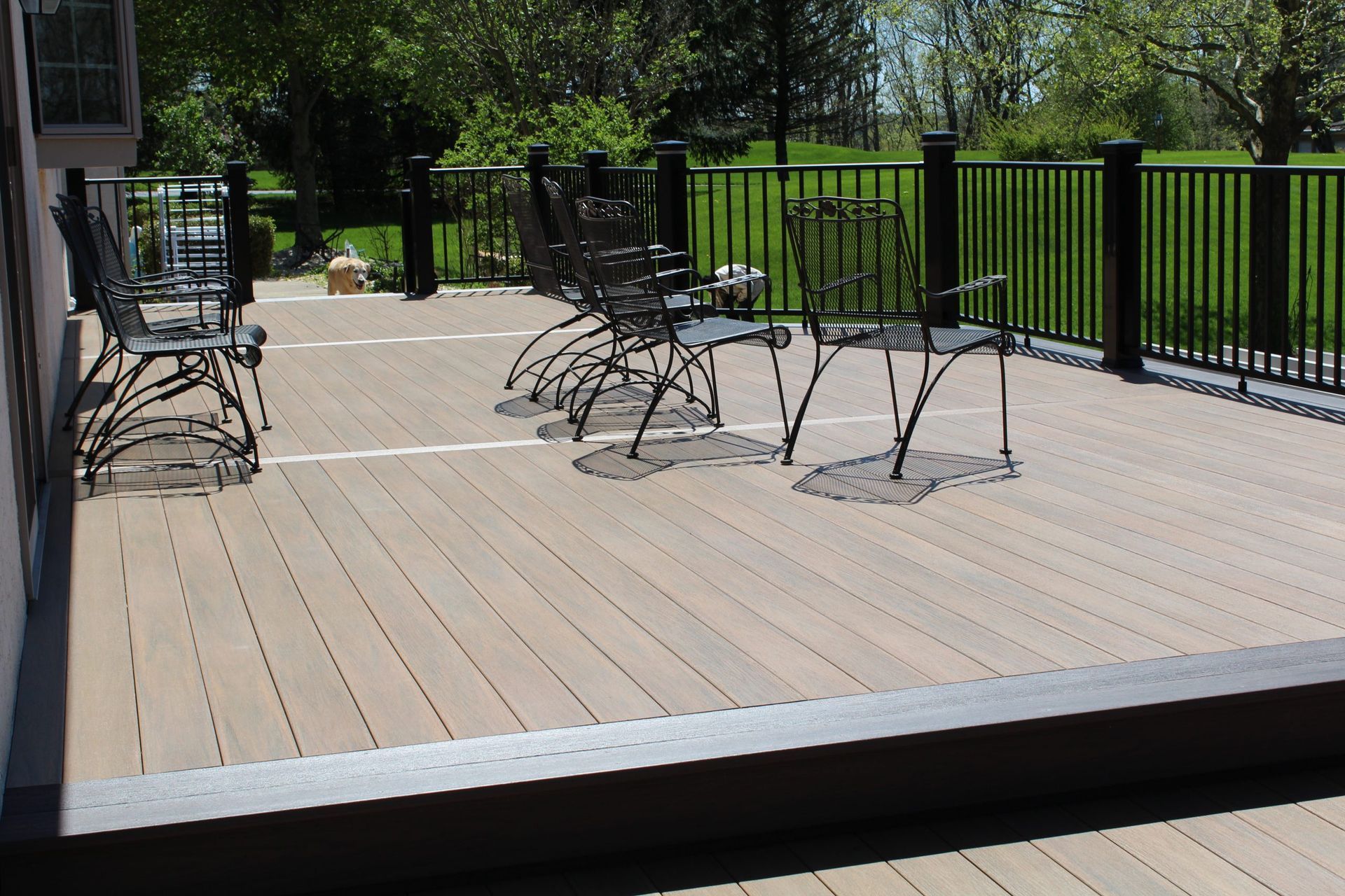 Custom railing design with lattice skirting on elevated deck constructed by New Dimensions NJ