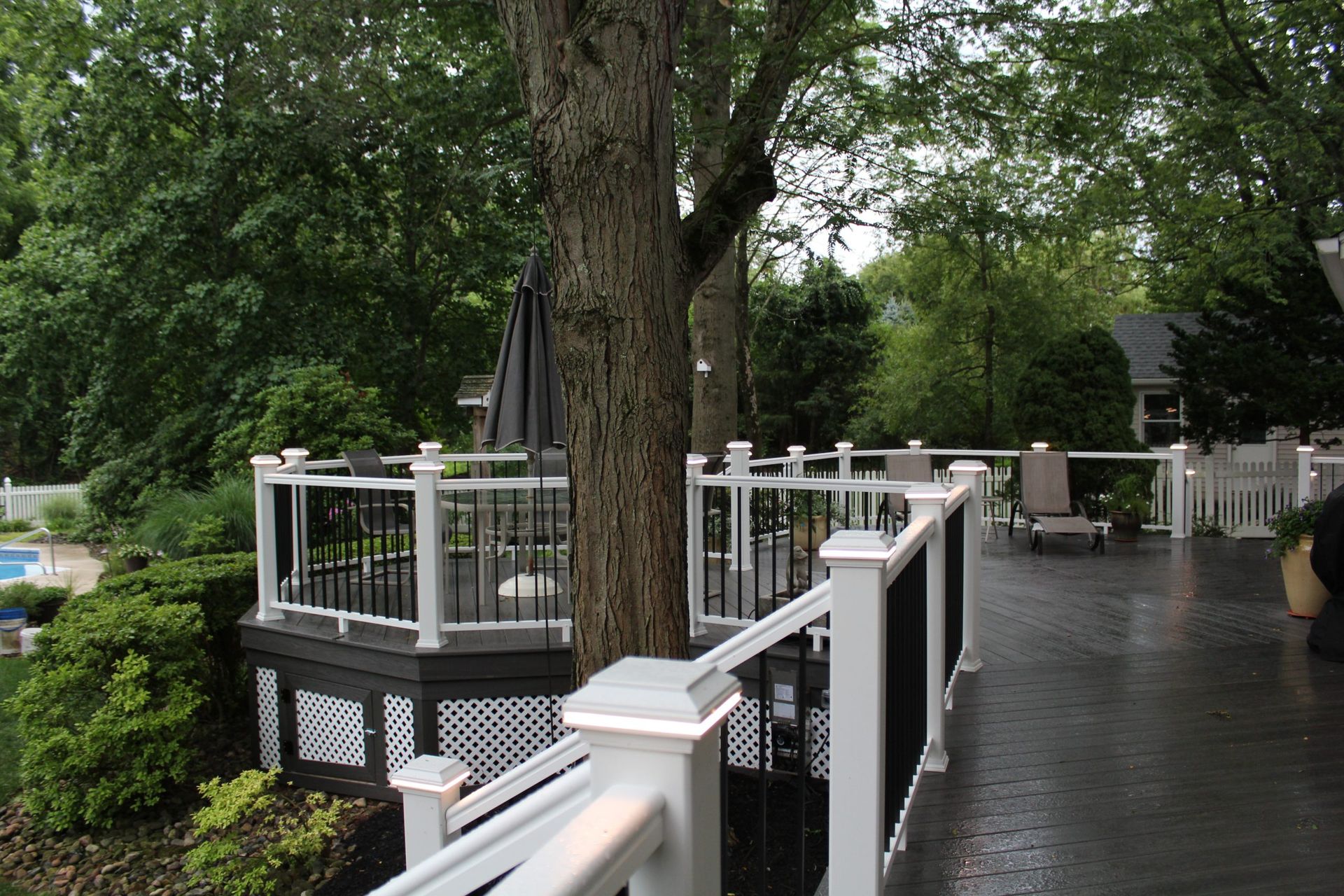 Backyard deck with privacy lattice panels.