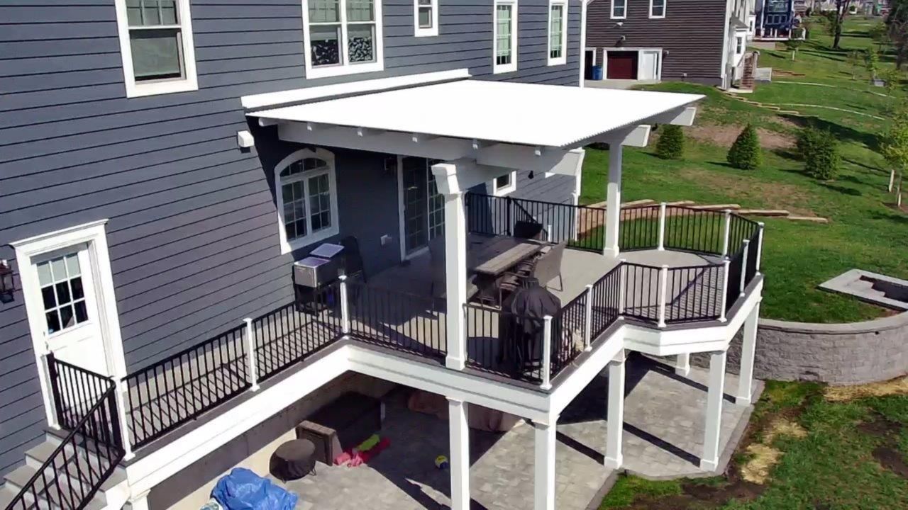 An aerial view of a house with a large deck.