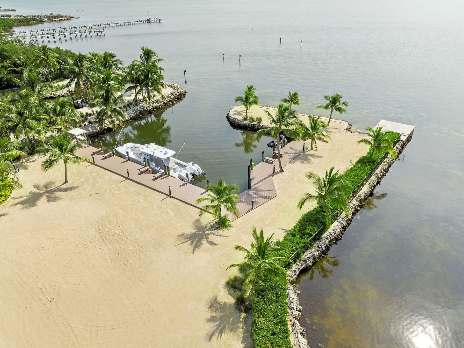 Private Marina, one of the many amenities of The Oasis in Islamorada, Florida is  offered for Sale by THE FIRM REALTY GROUP. 