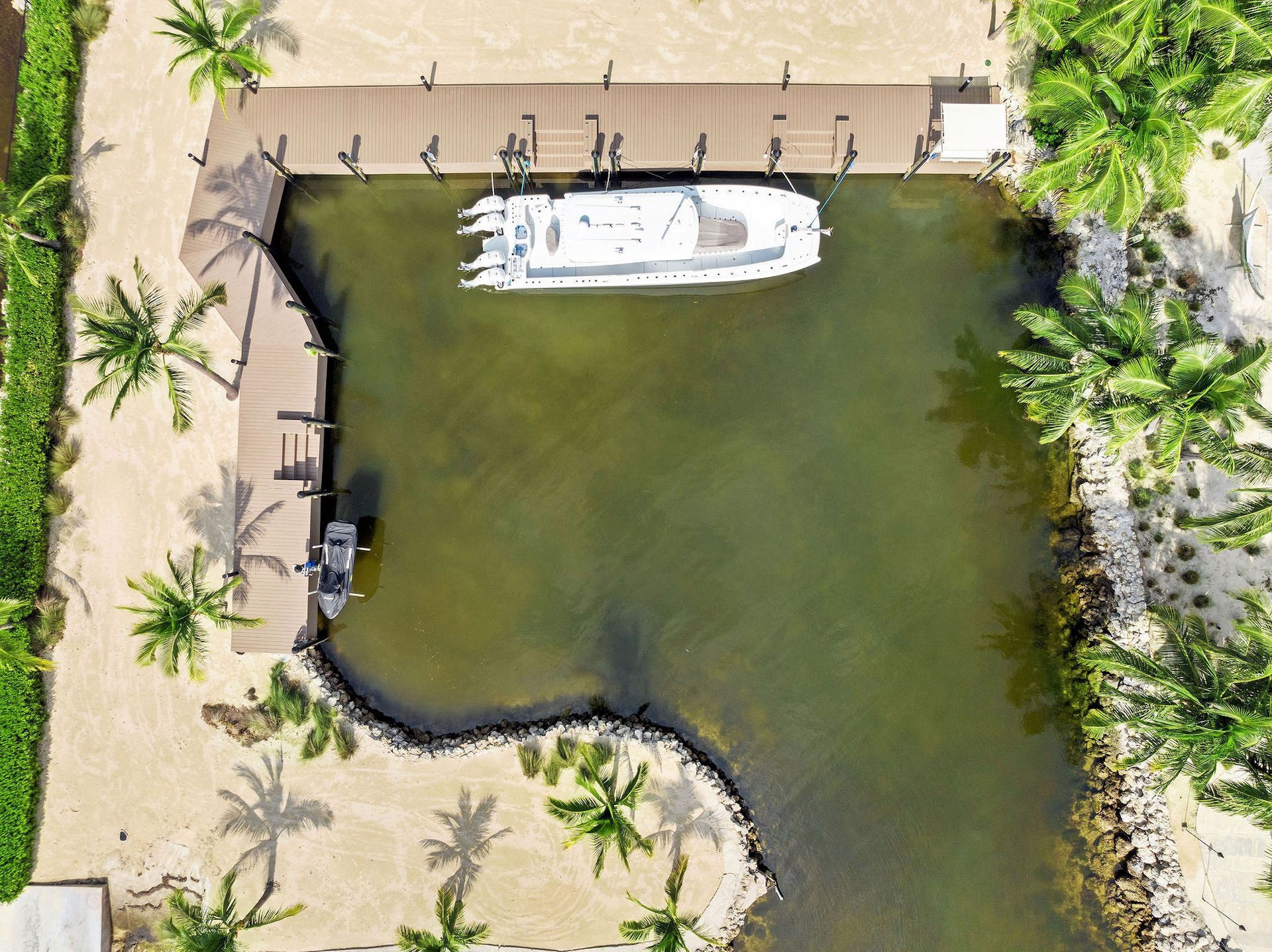 Private Marina, one of the many amenities of The Oasis in Islamorada, Florida is  offered for Sale by THE FIRM REALTY GROUP. 