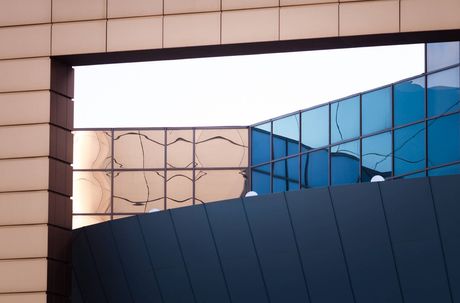 a reflection of a building in a window