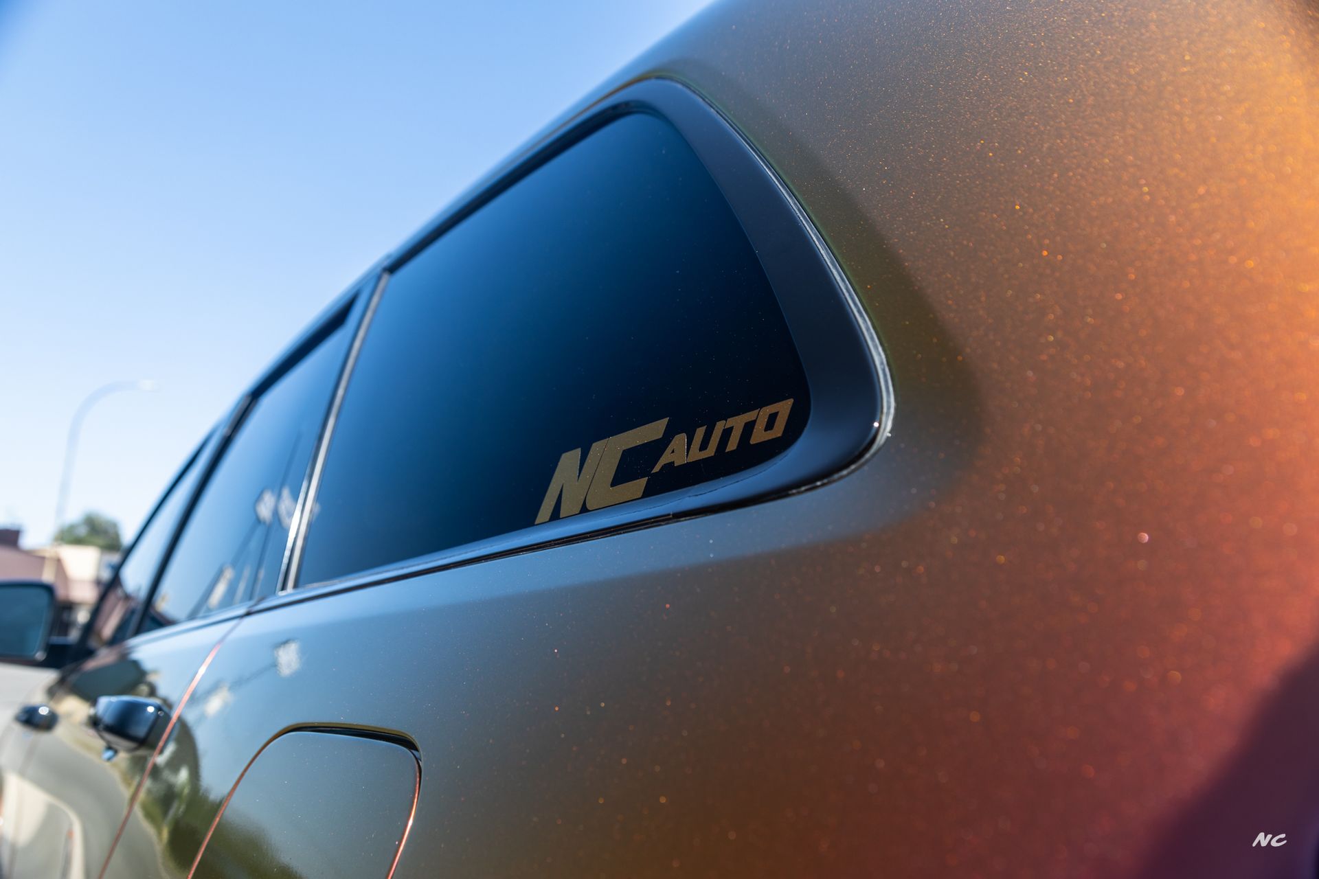 Close-up of a vehicle with tinted windows and a 