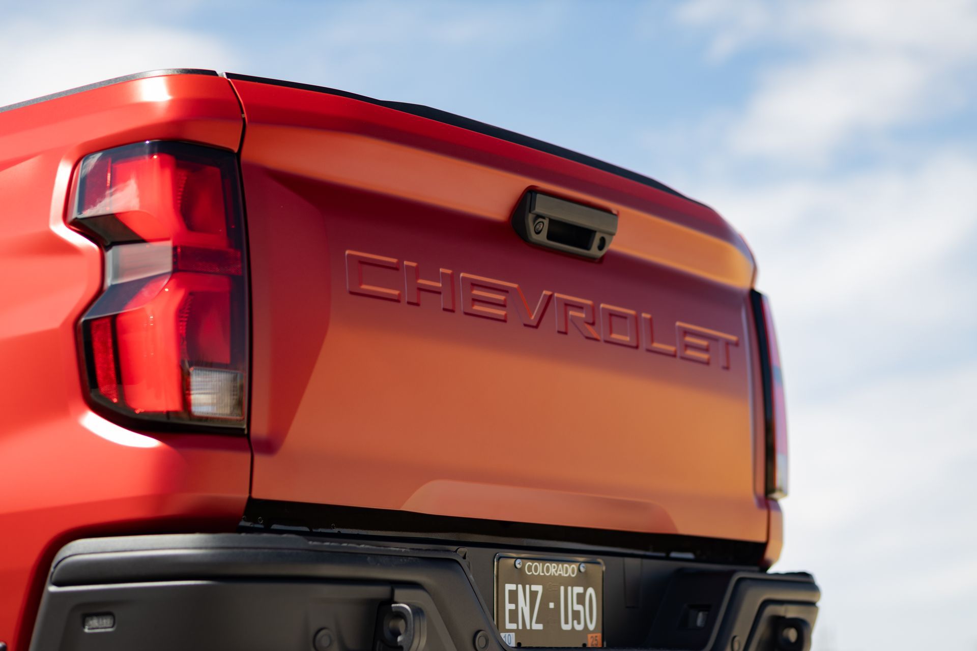 Red Chevrolet Silverado truck tailgate with embossed 