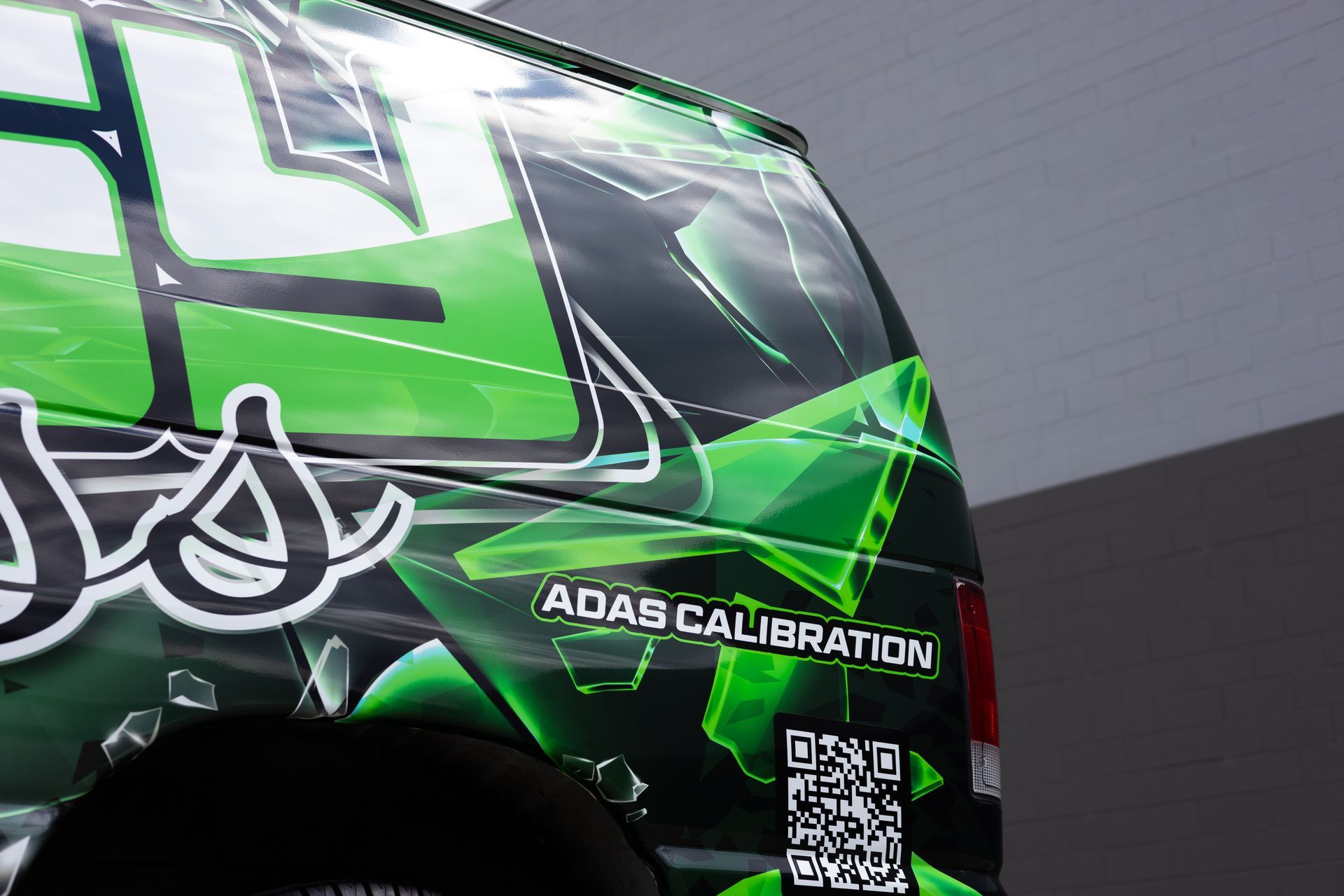 Green and black van with 