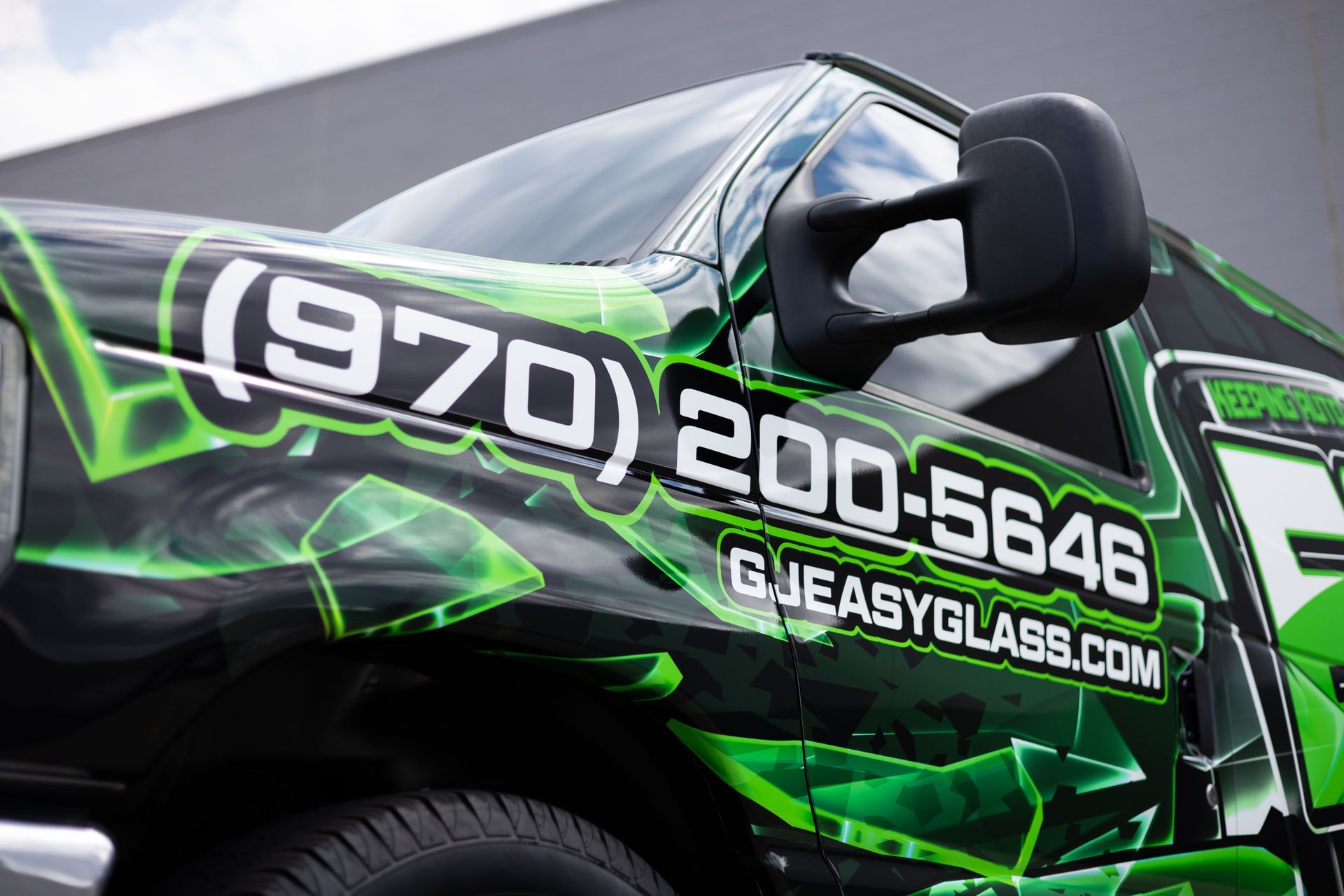 Green and black truck with 