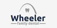 A logo for wheeler family dental with a tooth on it.