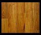Wooden hardwood floor, golden brown with visible wood grain.
