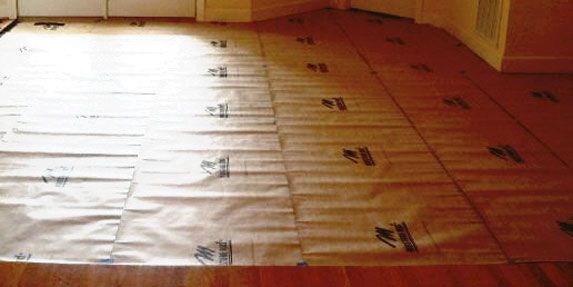 Wood flooring with protective covering.