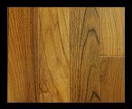 Wooden floorboards, varying shades of brown, with visible wood grain.