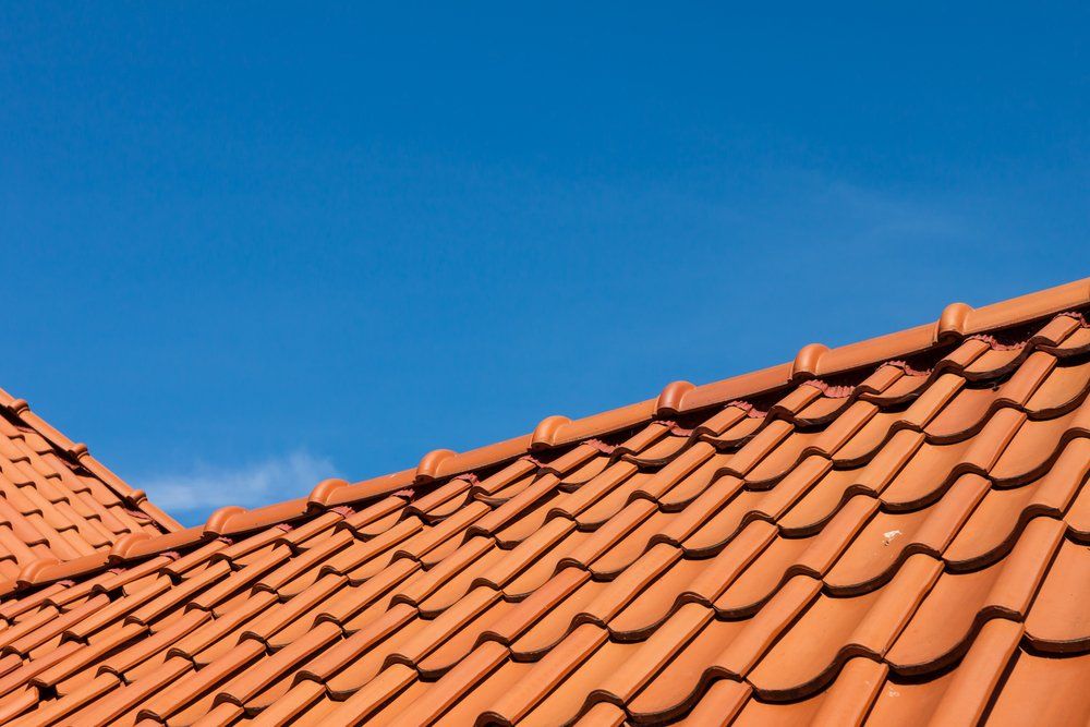Roof Tile Pattern Over Blue Sky — Second-Hand Roof Tiles in Newcastle, NSW