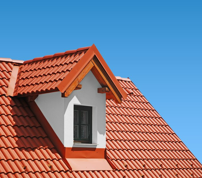 Roof With Red Tiles on a Background of Blue Sky — Second-Hand Roof Tiles in Wyong, NSW