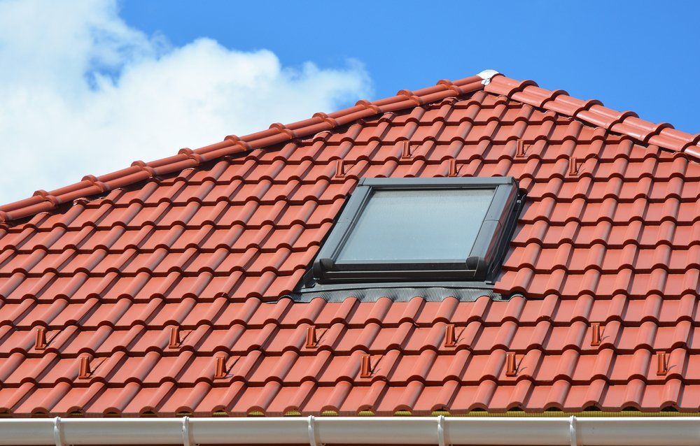 Skylight on Red Ceramic Roof Tiles — Second-Hand Roof Tiles in Newcastle, NSW