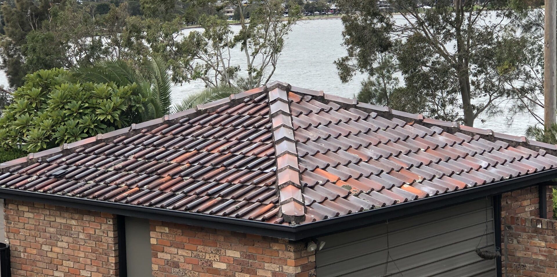 different coloured terracotta roof tiles installed on home