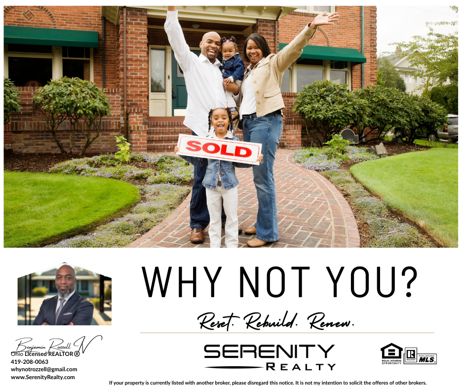 Family in front of their new house, holding a 