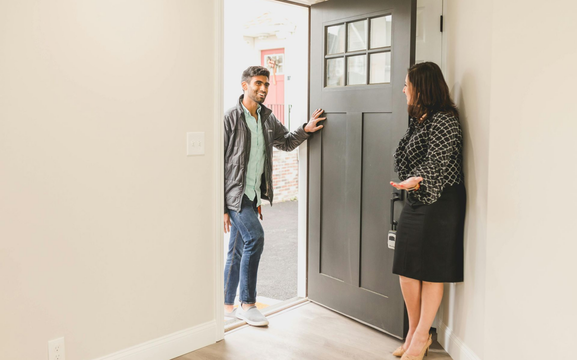 Young couple excited to tour their first home in Northwest Ohio.