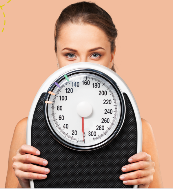 Woman holding a weight scale. The dial shows approximately 110 pounds.