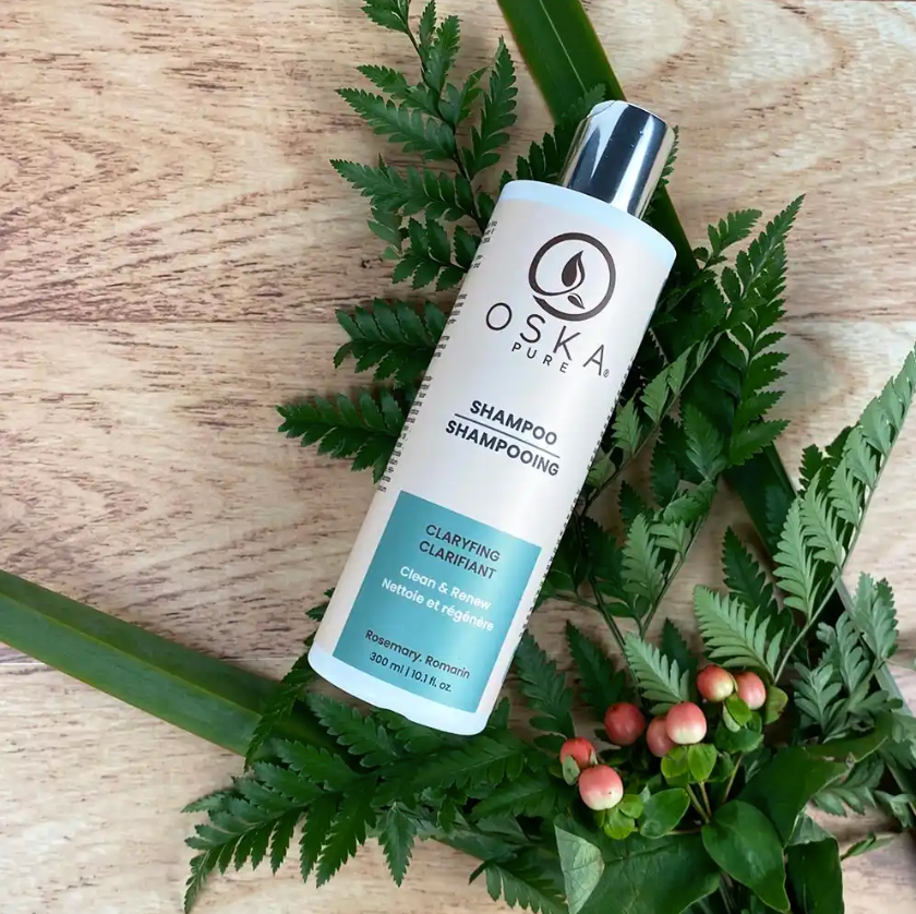 Bottle of Oska Pure clarifying shampoo on a light-colored background.