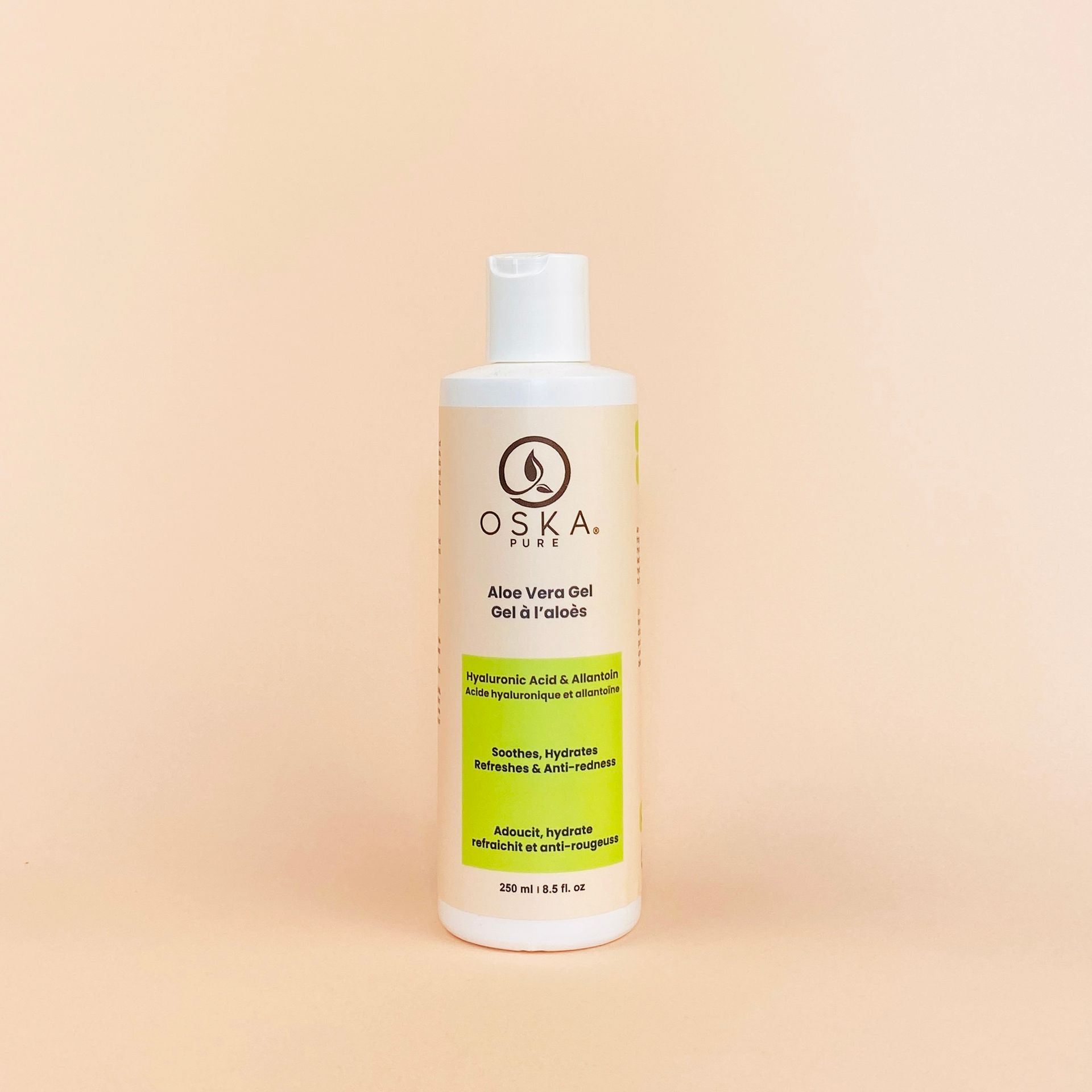A white bottle of "OSKA" lime vera gel with green label on a peach background.
