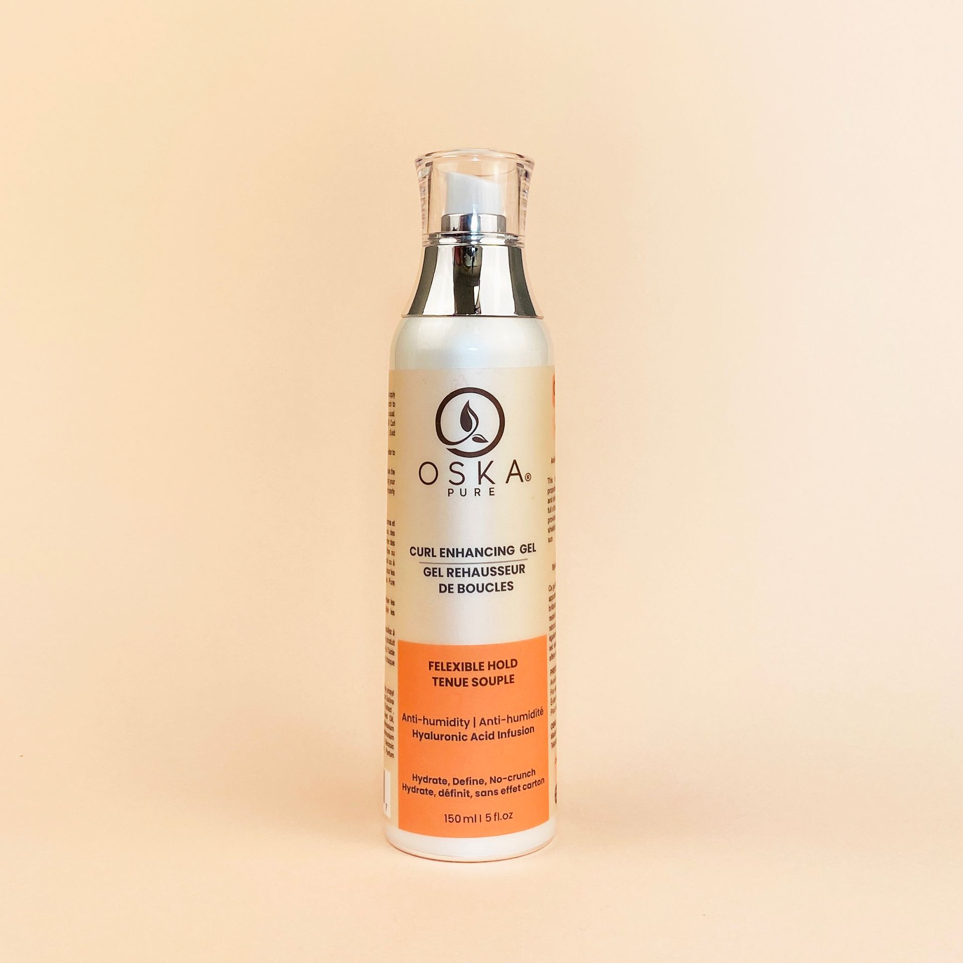 Bottle of CSKA. OIL face makeup remover on peach background.