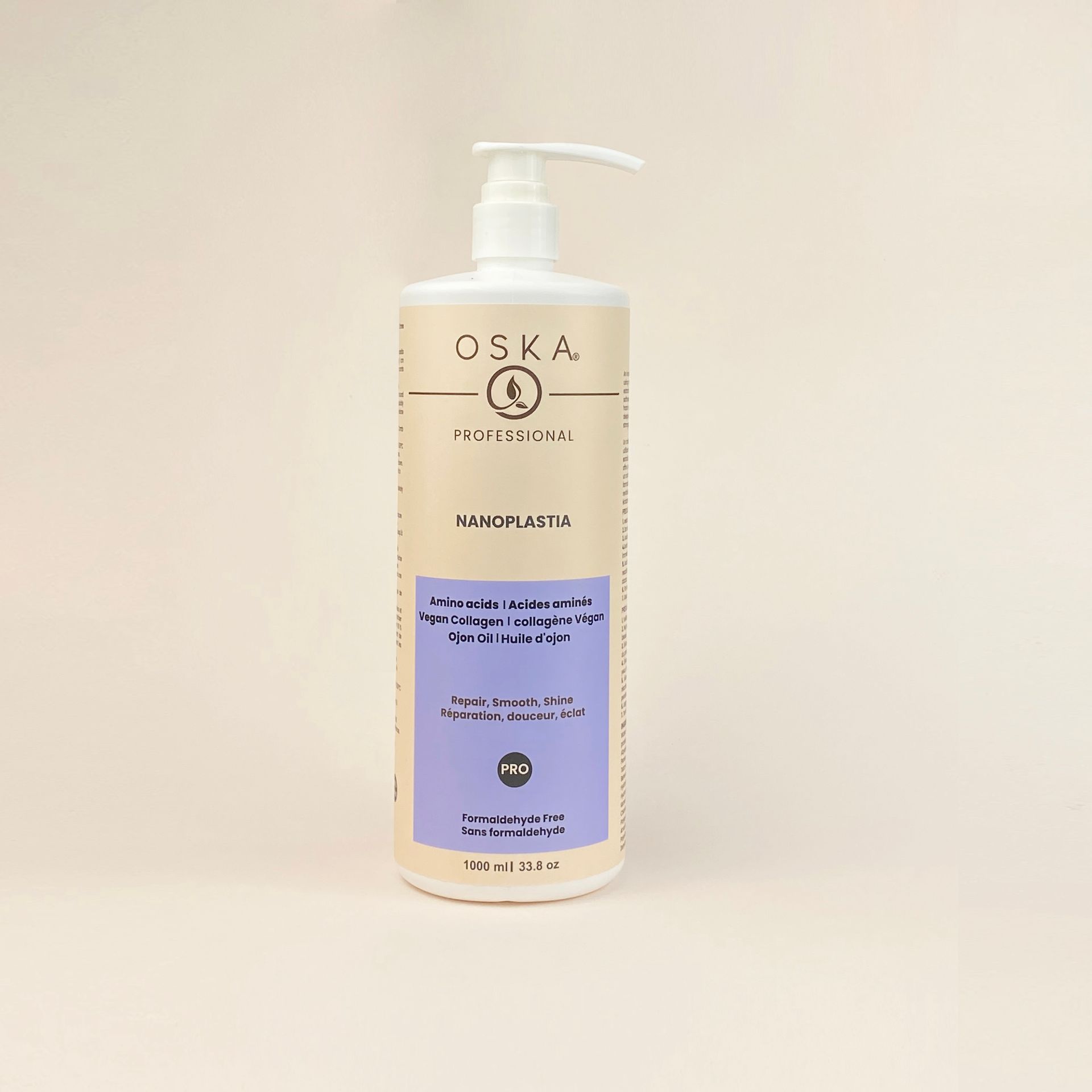 Tall white bottle of OSKA shampoo with a pump, against a white background.