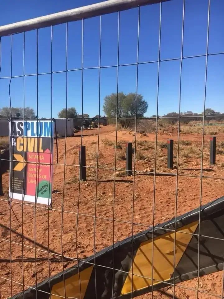 A Fence With a Sign on It That Says Asylum Civil — ASPLUM & CIVIL In Alice Springs, NT